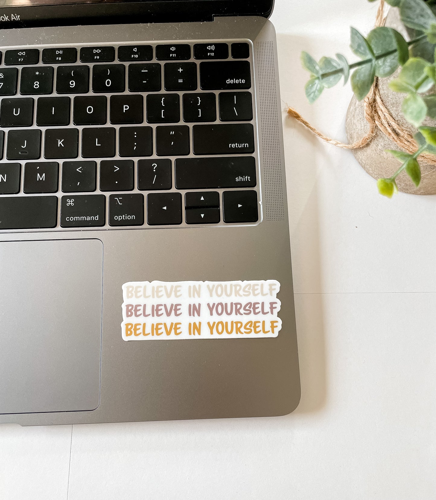 believe in yourself sticker pictured on laptop